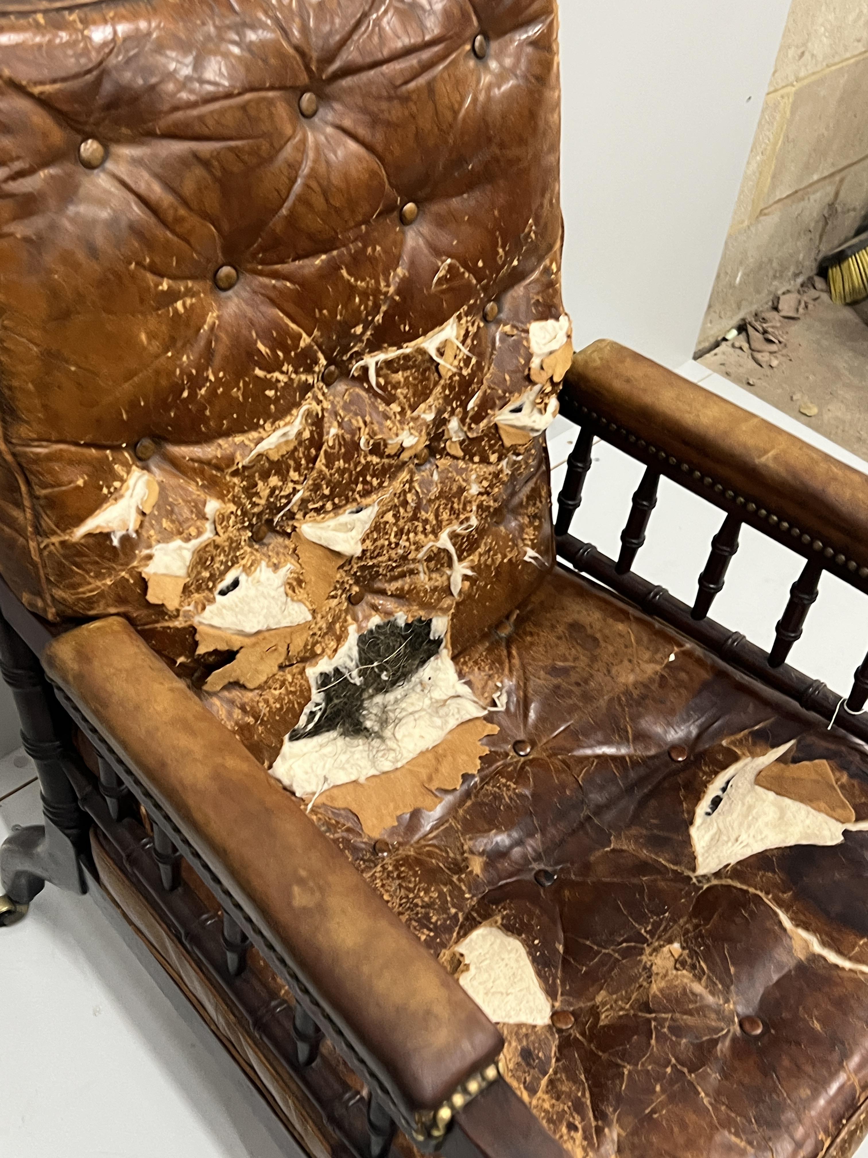 An early Victorian turned mahogany library chair with distressed leather cushion seat and back, width 62cm, depth 66cm, height 104cm